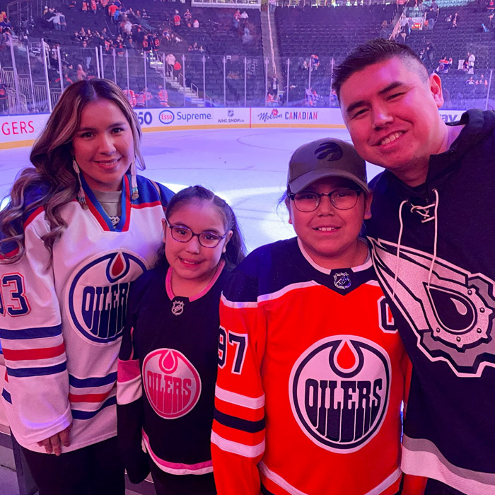 Kendal Netmaker with his family at an Edmonton Oilers hockey game (Photo: submitted)