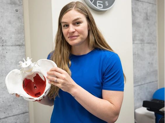 Reimer holds a pelvic model in her office at Synergy Strength and Conditioning. PHOTO BY MICHELLE BERG /Saskatoon StarPhoenix
