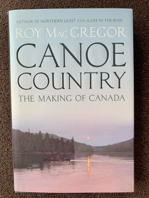 The cover of Roy MacGregor's book features a painting from the McCreath Canoe Collection. (Photo: Kathryn Warden) 
