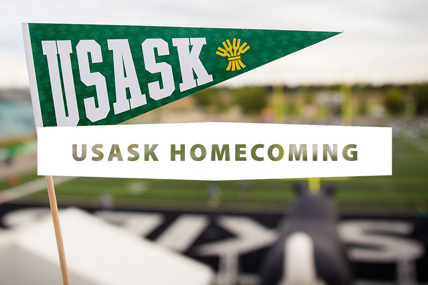 USask pennant flag with Griffiths Stadium field in the background