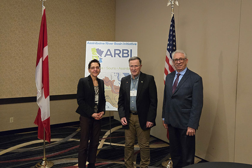 Dr. Allan Preston (centre) poses with board member Maureen Cousins (left) and MP Larry Maguire (right)