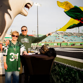 Huskie fans waving large Saskatchewan flag