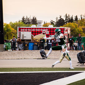 Huskie catching football